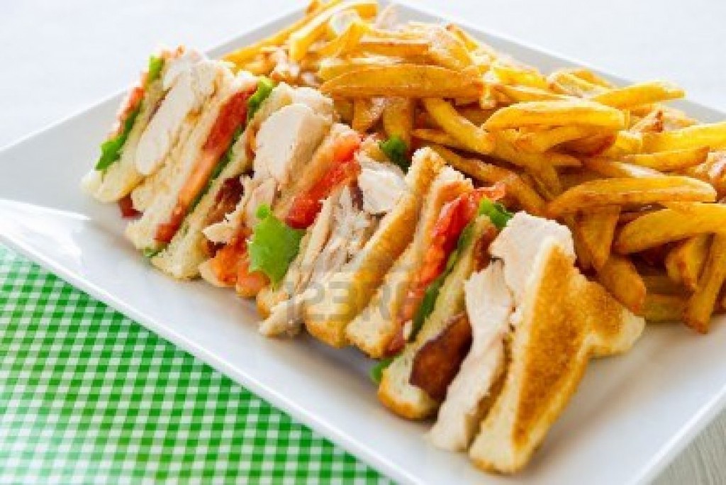 Chicken club sandwich in a white plate meal time